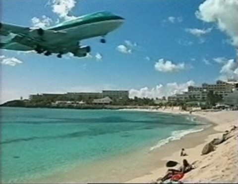 Plane flies over beach for Bigpond Beach Holiday TV Ad