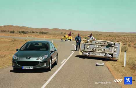 Peugeot 407 passes rolled toy car in TV ad