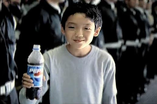 Boy bows with reverence in Pepsi TV Ad