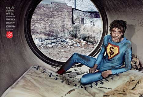 Homeless man wears superman costume in Salvation Army print ad