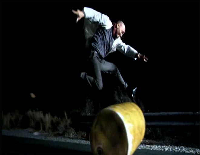 Man jumps over barrel in Hondamentalism TV ad