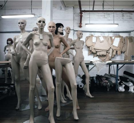 Woman posing among mannequins for British Council competition