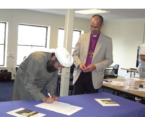 Ethical Witness signing by bishop and imam for Christian Muslim forum