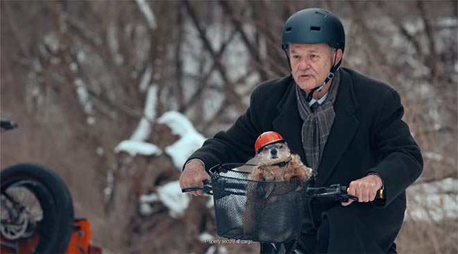 Bill Murray as Phil Connor on bike in Jeep Groundhog Day commercial